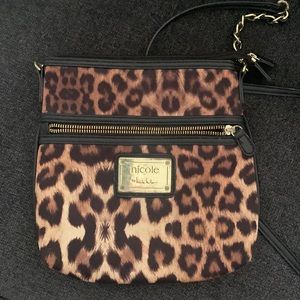 cat print purse with black handle and gold chain very stylish